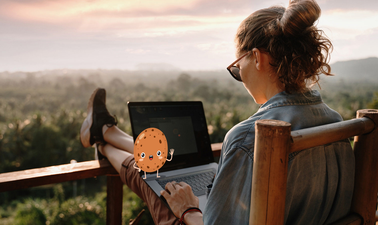 A cookie-man on a computer while a woman is using it